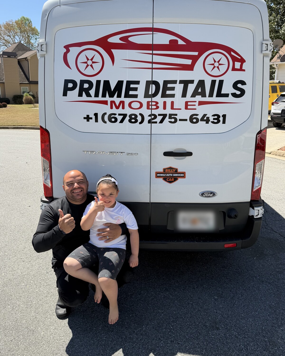 Our lead detailer and his daughter at the back of the Prime Details van